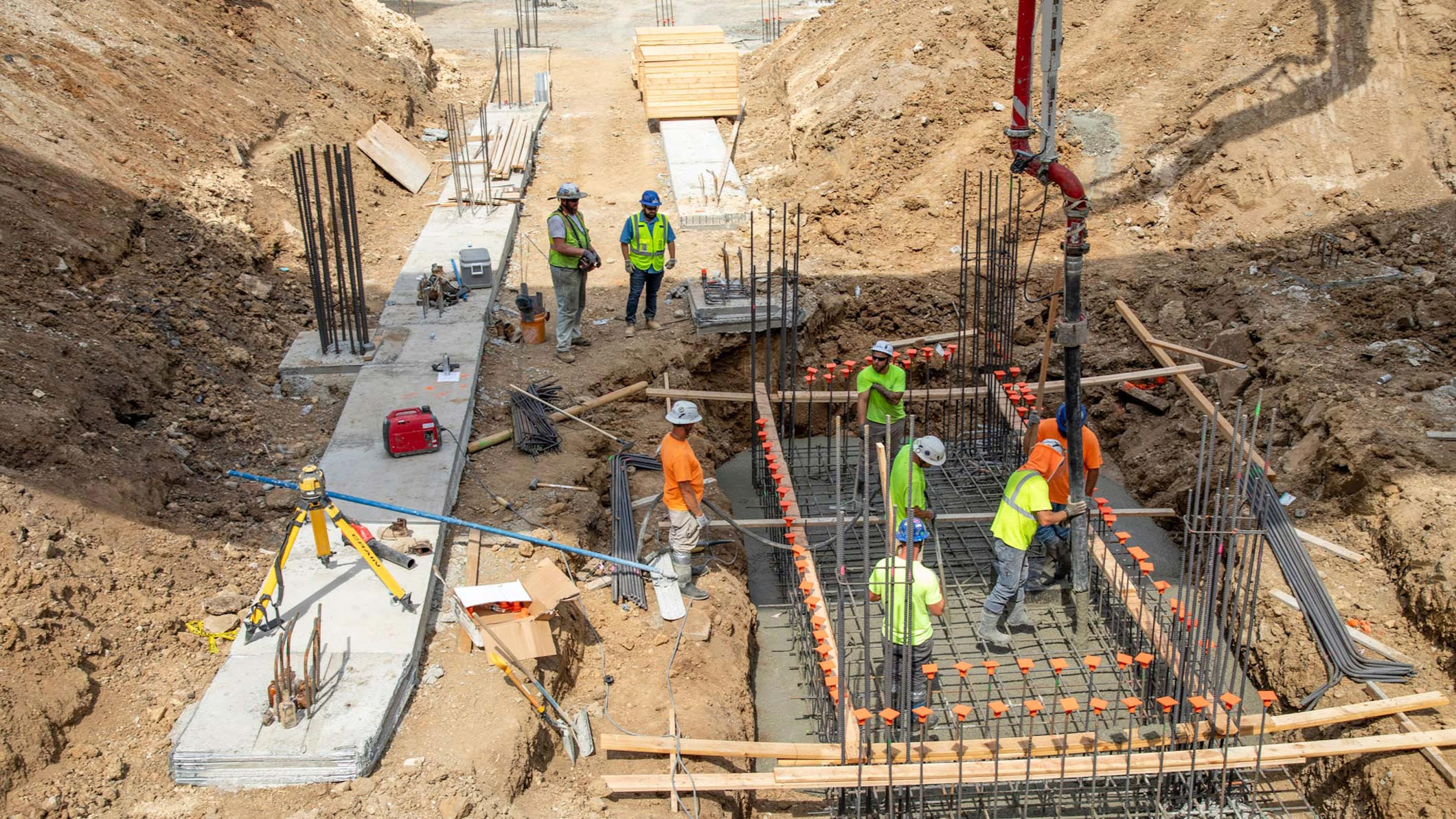 JE Dunn team actively pouring a concrete pad at a construction site in Kansas City.