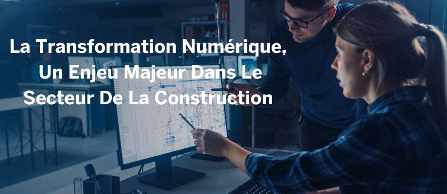 Two construction professionals collaborate on a blueprint displayed on a computer screen, illustrating digital transformation in the industry.