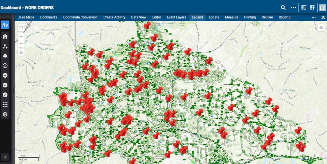 Map showing numerous red pins marking open work orders across a city grid.