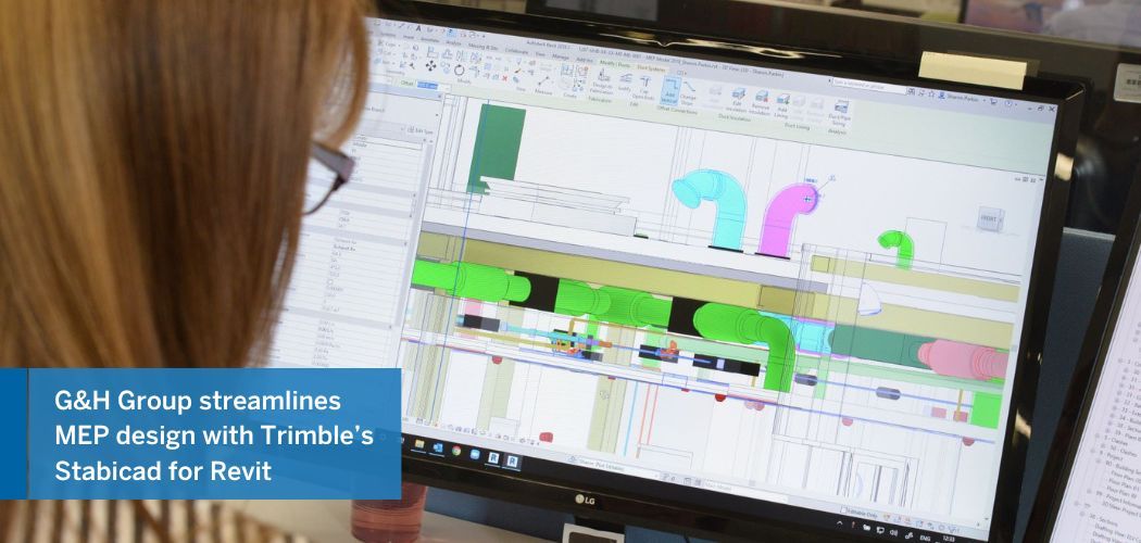 A person designs MEP systems on a computer using Trimble's Stabicad for Revit software.