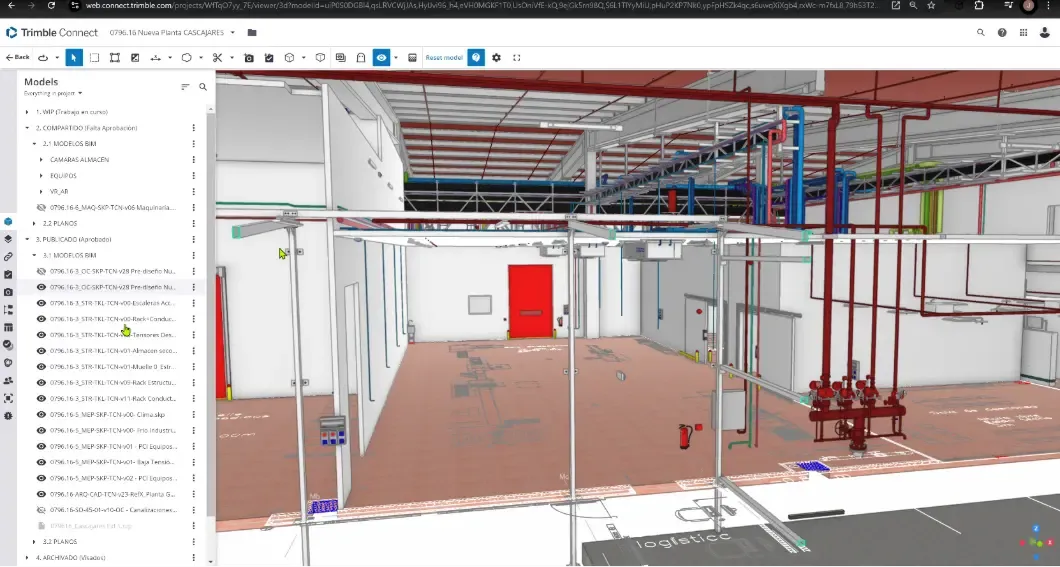 Model of an interior space of the factory showing an open space with exposed installation racks above.