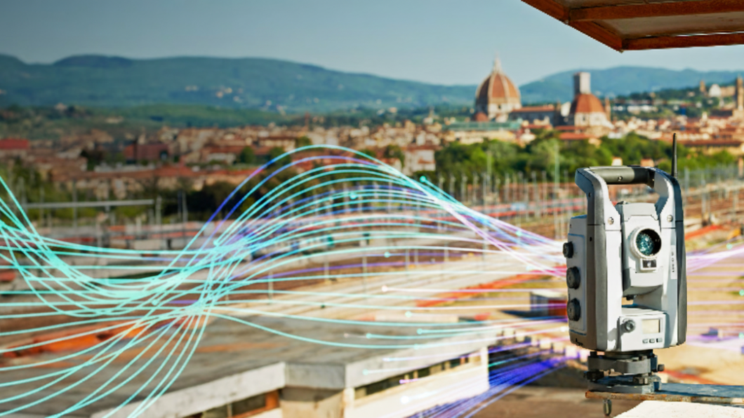 Surveying equipment overlooking a cityscape with digital wave graphics.