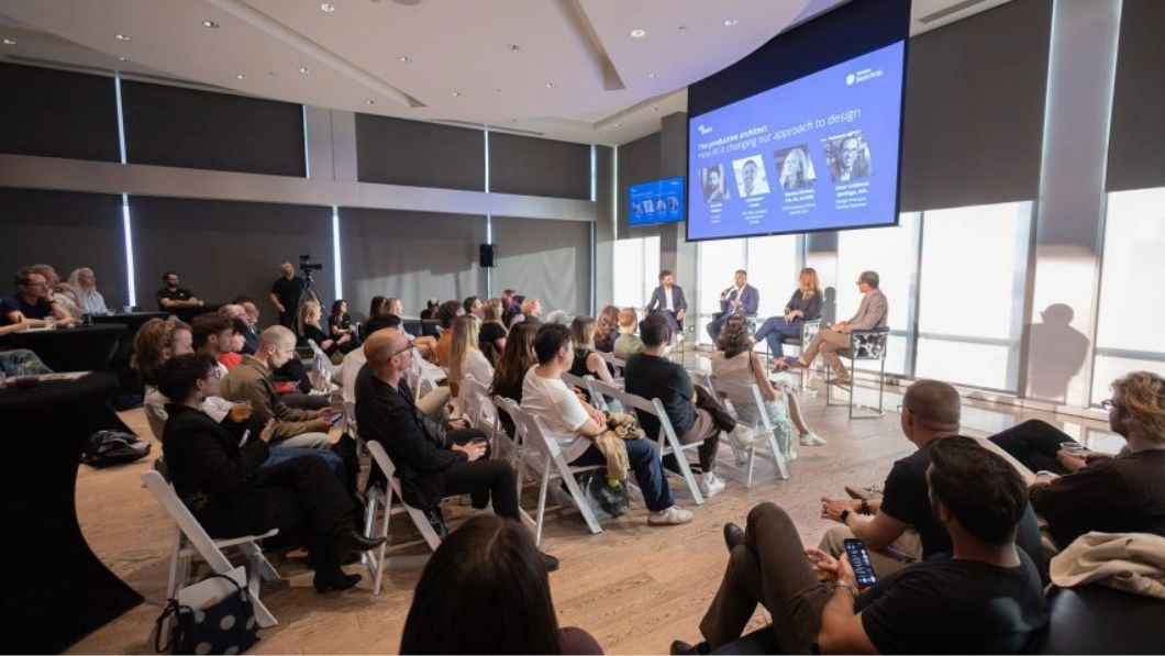 Audience watching panel of experts talking about AI and design at AIA event.