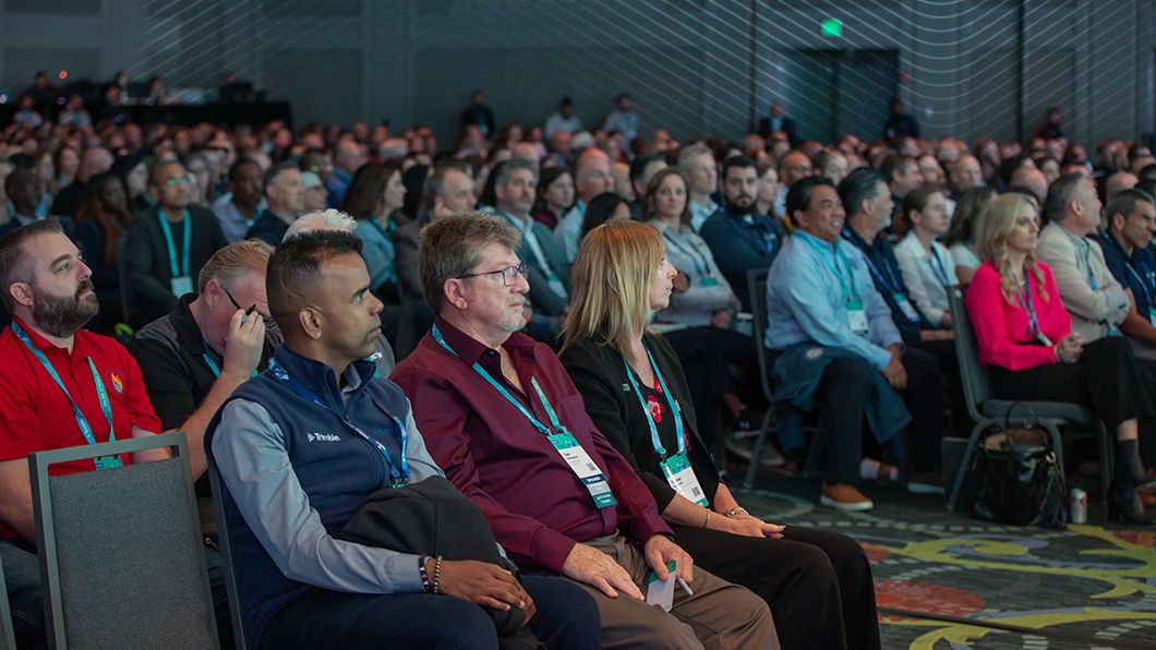 Attendees at Trimble Innovate 2025 conference listening to Rob Painter, CEO, Trimble