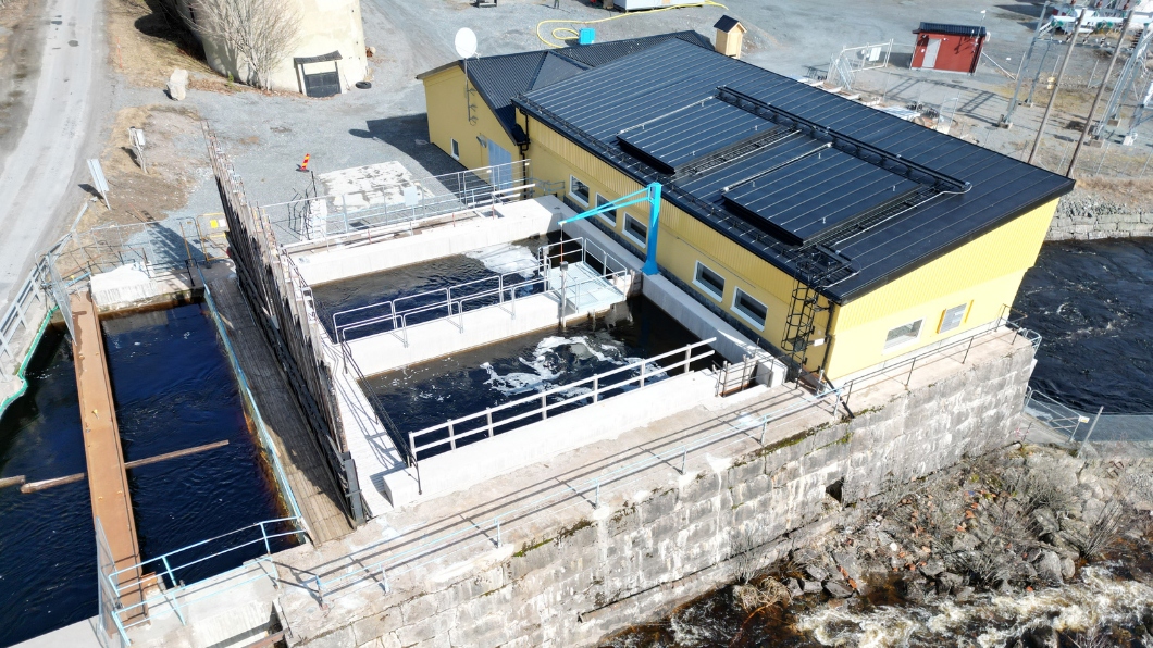 A view of the Rockesholm hydropower station construction site, showing the integration of the structure with the environment.