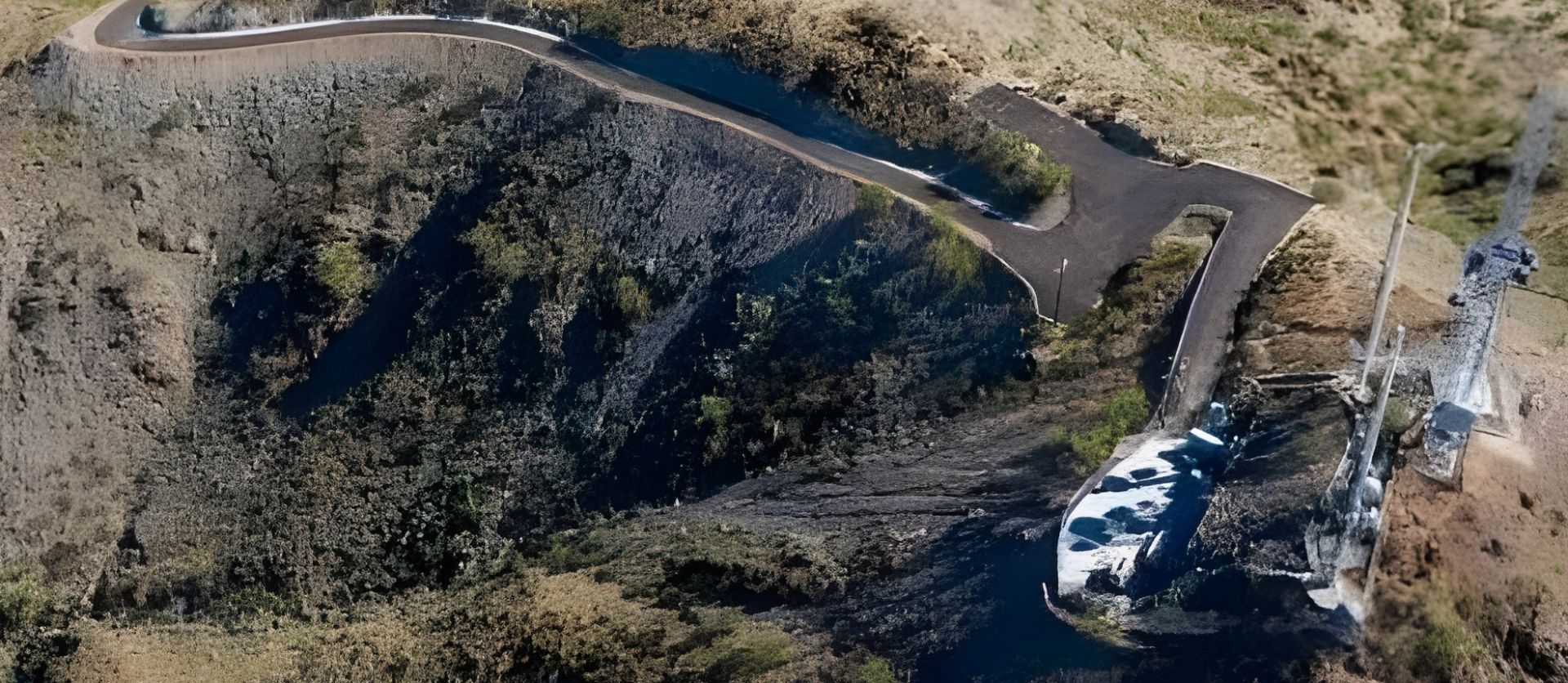 Overhead view of a winding road and communication towers atop steep, rugged terrain on North Mountain.