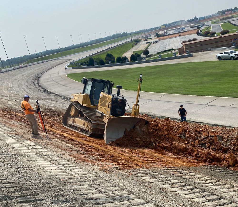 Dozer working on angle of speedway
