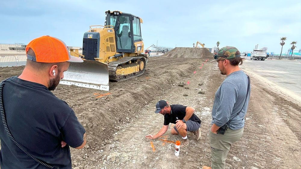 Men working on dirt track design