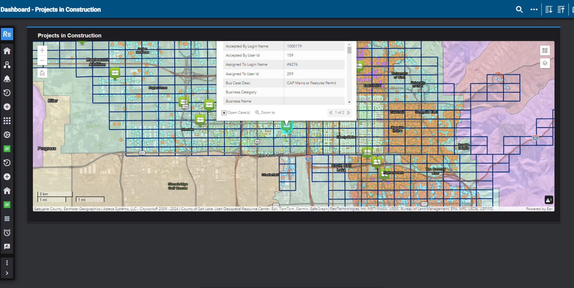 A GIS map shows construction projects throughout the SLCDPU service area.
