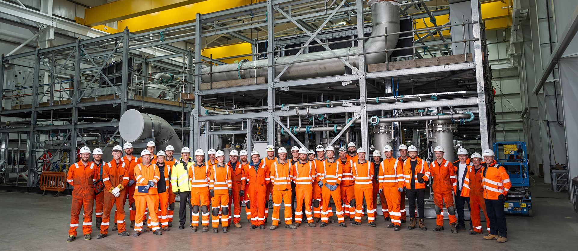 The RSE team stands in front of TTU® modules on a completed project.