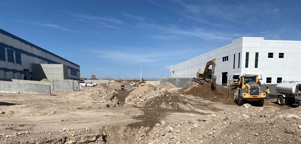 machines moving dirt on construction site