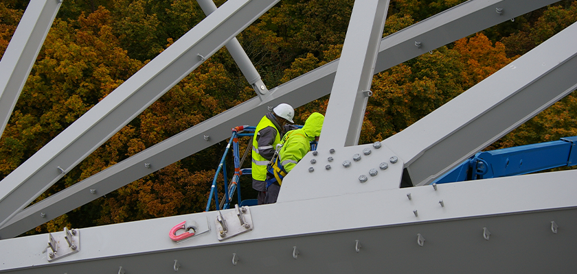On-site with BDS Vircon during the construction of Fondation Louis Vuitton, construction workers stand by huge steel connecti