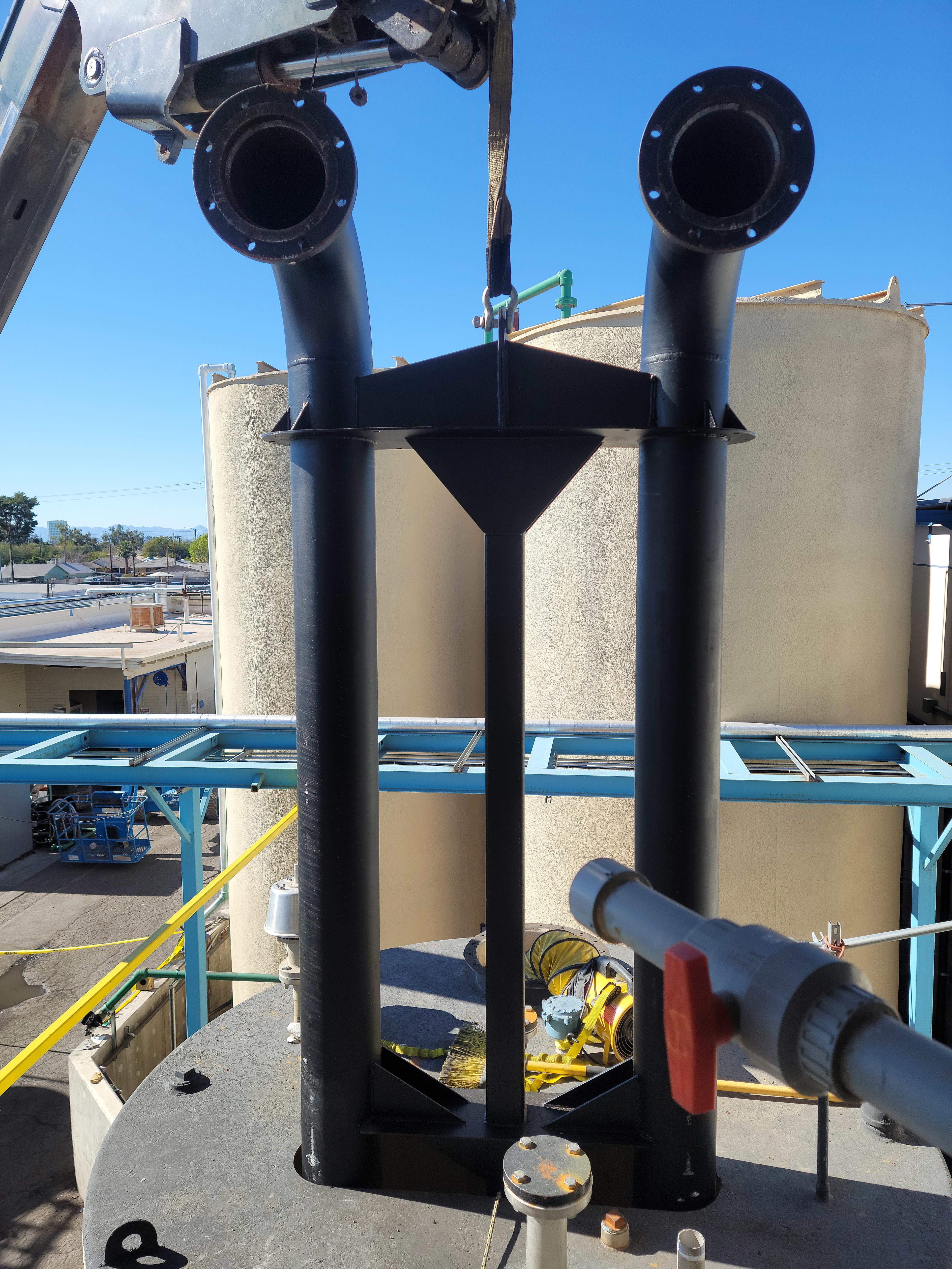 Header for the cooling system being installed into the break tank.