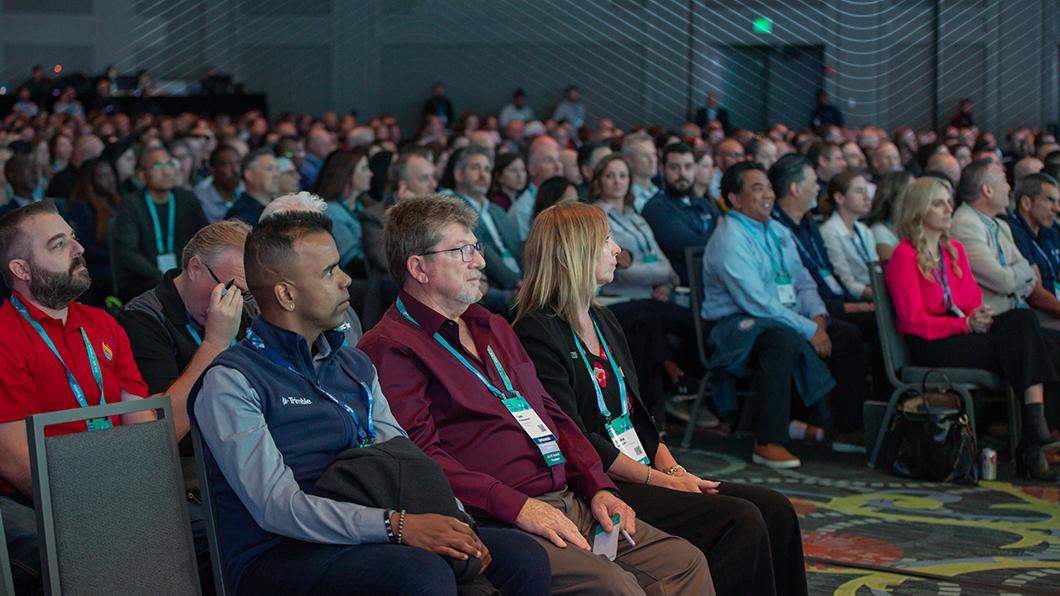 Attendees at Trimble Innovate 2025 conference listening to Rob Painter, CEO, Trimble
